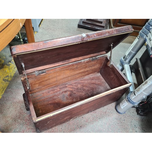 433 - A fabulous good sized vintage mid century wooden storage chest with hinged lid and handles to side.