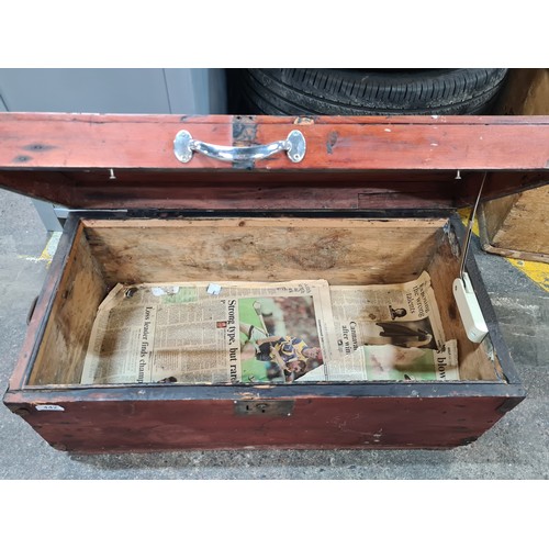 442 - A very large antique wooden storage chest with brass lock to front and cast metal reinforcements to ... 