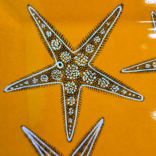 120 - A stunning vintage original Hermes display tile in a vibrant orange and featuring a starfish pattern... 