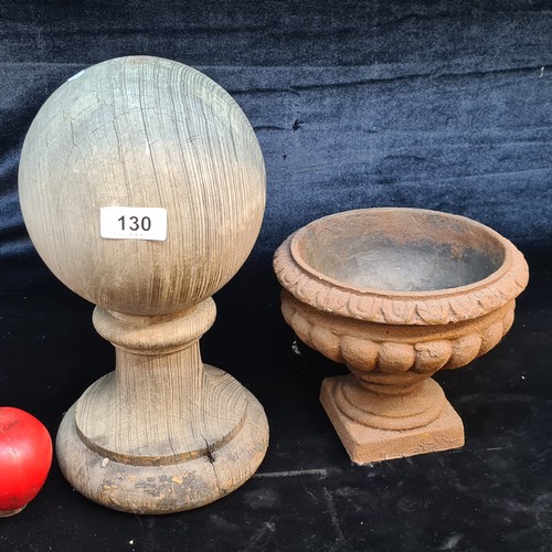 130 - Two items including a wooden hat stand and an antique cast metal urn.