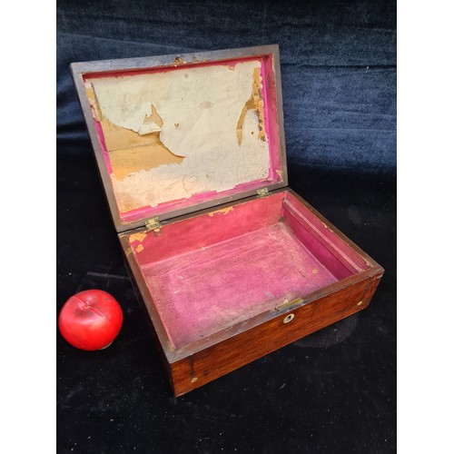 153 - An antique 19th century mahogany storage box featuring mother of pearl detail to top.