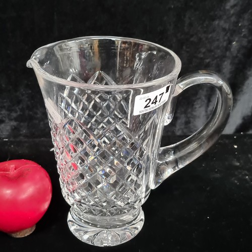 247 - A stunning Waterford Crystal Large Whiskey water pitcher jug. In good order with acid mark to base.