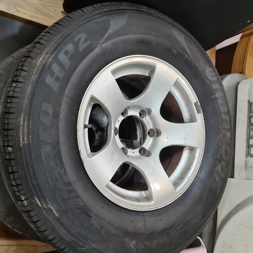 440 - Four tyres including a pair of Bridgestone Dueler H/T radial tubeless tyres along with a pair of Han... 