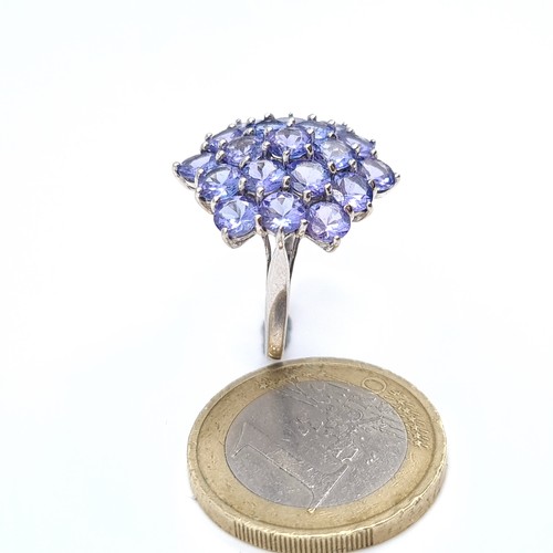 16 - Star Lot : A nice example of a nine carat gold Tanzanite statement ring. Ring size - O. Weight - 3.8... 