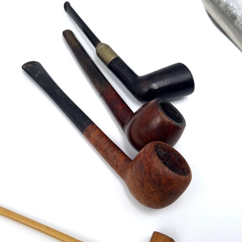 32 - A large interesting collection of smoking pipes. 14 in total inc some really interesting antique exa... 