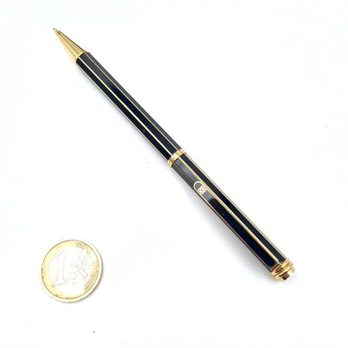 504 - An as new propelling pencil by Givenchy set with gold metal markings. Presented in box.