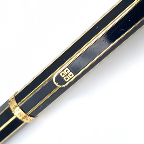 504 - An as new propelling pencil by Givenchy set with gold metal markings. Presented in box.