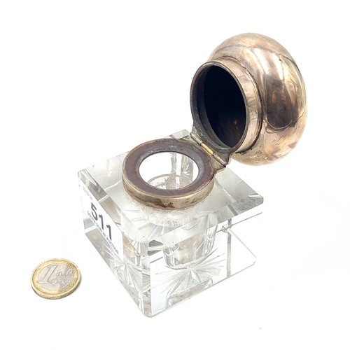 511 - A cut glass ink well with sterling silver collar and hinged lid. Hallmarked London. Weight of silver... 