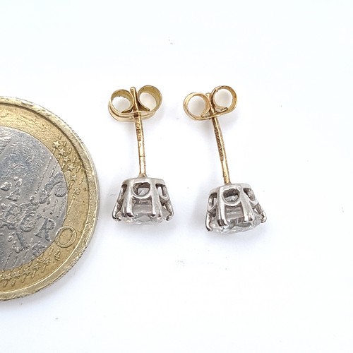 514 - A pair of hallmarked nine carat gold gem set stud earrings. Total Weight - 1.48 grams.