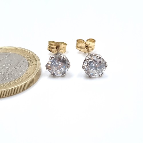 514 - A pair of hallmarked nine carat gold gem set stud earrings. Total Weight - 1.48 grams.