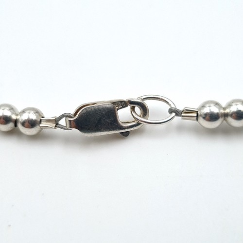 523 - A collection of two sterling silver items set with cut glass accents. The first bracelet set with sl... 