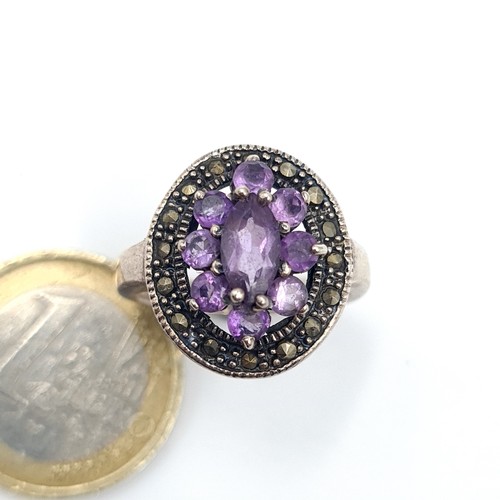 528 - A vintage amethyst and marcasite stone ring. Size - Q. Weight - 6.05 grams.