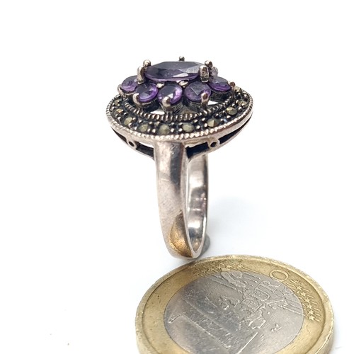 528 - A vintage amethyst and marcasite stone ring. Size - Q. Weight - 6.05 grams.