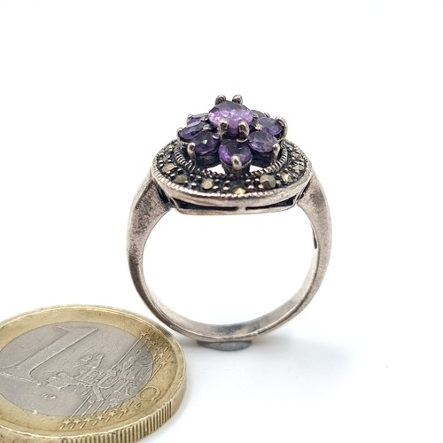 528 - A vintage amethyst and marcasite stone ring. Size - Q. Weight - 6.05 grams.