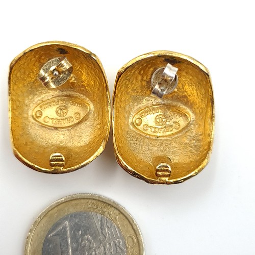 531 - Star Lot : A pair of gold toned Chanel stud earrings. Weight 16.7 grams. Fully marked on the Back Ch... 