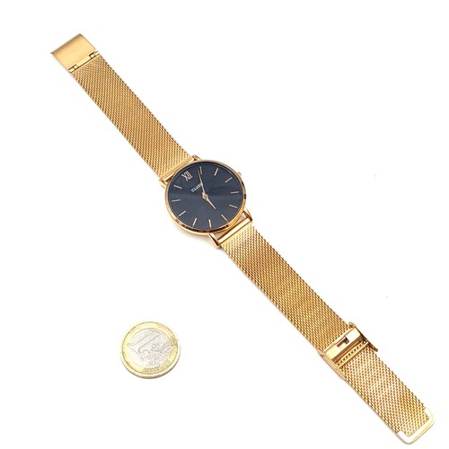 537 - A Jon Von Arx cluse wrist watch with gold pattern dial and hands together with a gold mesh bracelet.