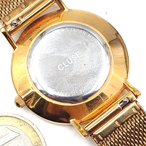 537 - A Jon Von Arx cluse wrist watch with gold pattern dial and hands together with a gold mesh bracelet.