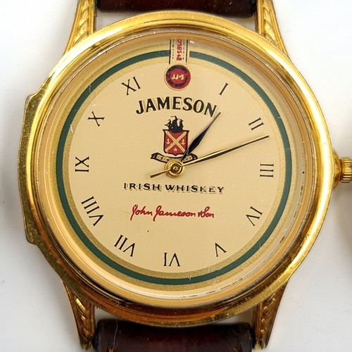 544 - Three leather strapped wrist watches. Two promotional watches. A Jameson and an Amstel together with... 