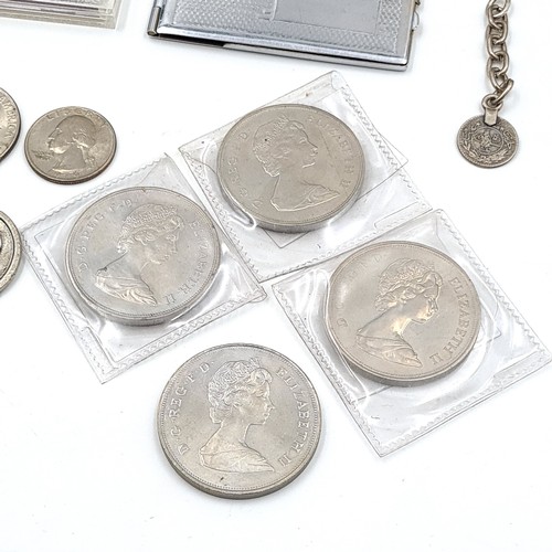 569 - A collection of coins and medallions In a cigar box.