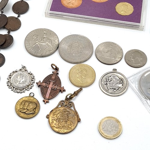 569 - A collection of coins and medallions In a cigar box.