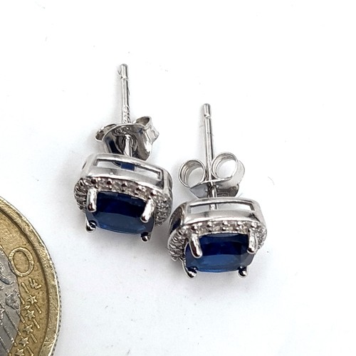 582 - A super pair of blue stone cushion cut stud earrings with Moissonite stone surround. Old new stock.