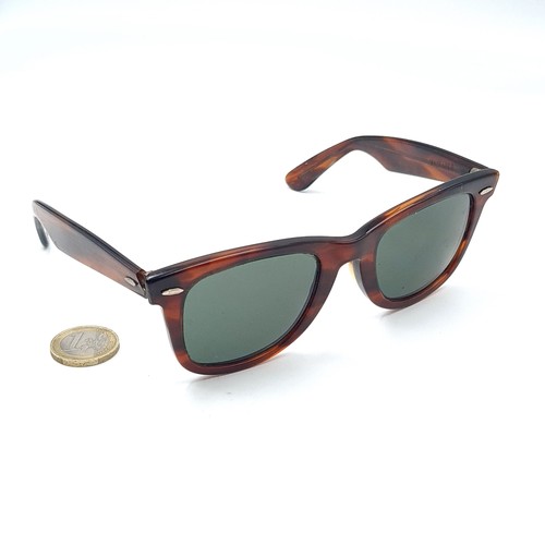 583 - A pair of wayfarer RayBan sunglasses in unused condition with case.