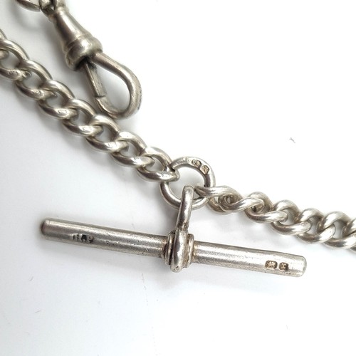 588 - An Edwardian sterling silver Albert chain with a finely decorated medallion plank to reverse. Hallma... 