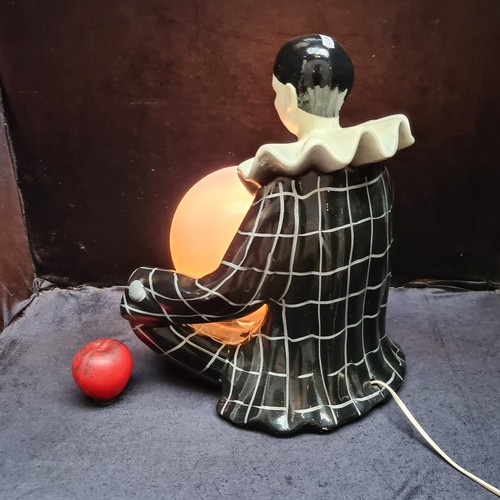 288 - An unusual large Pierrot style cast table lamp in the form of a harlequin clown figurine. A real tal... 