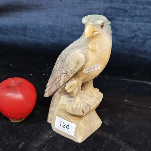 124 - A vintage heavy carved veined heavy cold marble falcon with glass eyes.