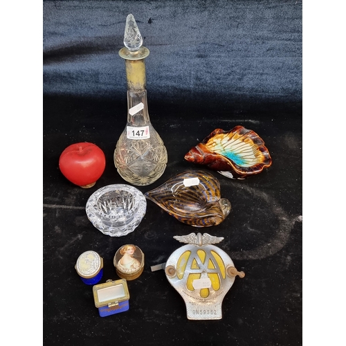 A mixed lot of 8 items including a Waterford Crystal ash tray, a cut glass decanter with EPNS silver plate collar, a ceramic and glass sea shells, antique pill / patch boxes and an AA membership badge.