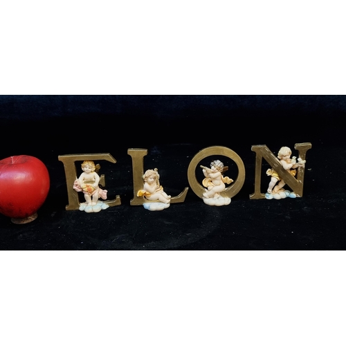 175 - A box containing an adorable set of four cherub figures spelling out the word NOEL. Or Elon if you'r... 