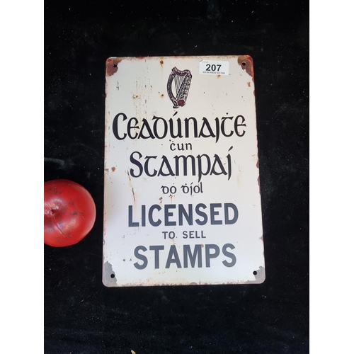 207 - A printed metal sign 'Licensed to sell Stamps'.