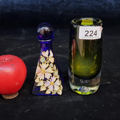 224 - Two vintage glass items including a hand painted blue decanter and a heavy green smoked glass bud va... 