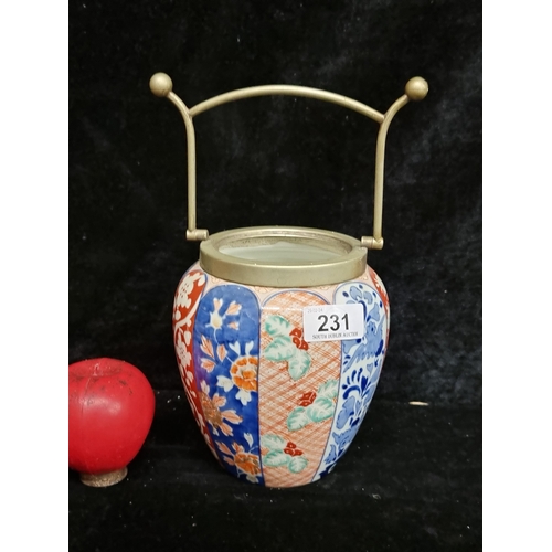 231 - A beautiful Japanese fukagawa porcelain biscuit barrel in imari patterns with silver plated rim and ... 