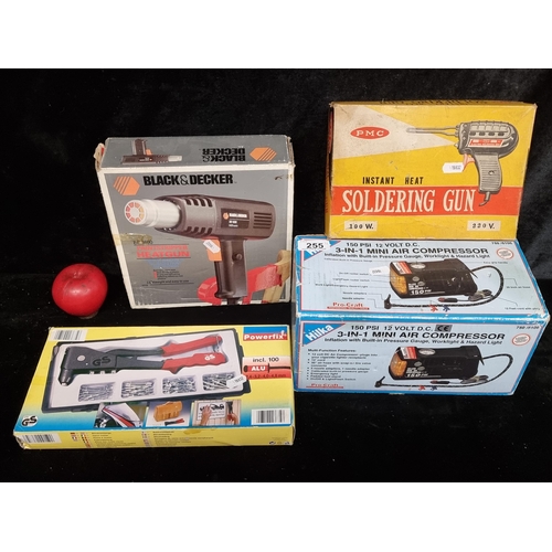 255 - Four boxed vintage tools including a Black & Decker paint stripper heat gun and a PMC instant heat s... 