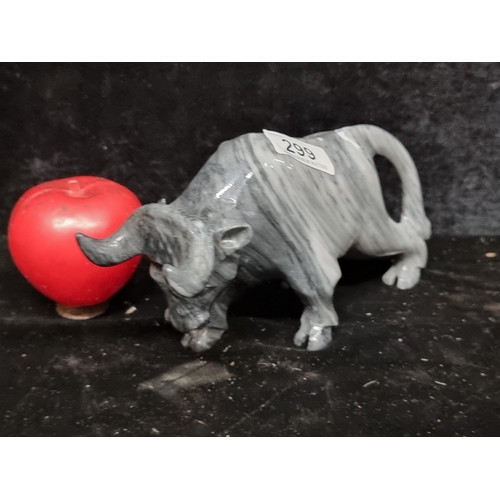 299 - A highly detailed cold marble figure of a charging bull. Heavy and cold to the touch.