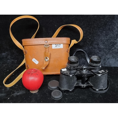 317 - A pair of vintage 8 x 30 Atlas binoculars housed in a brown leather travel case.