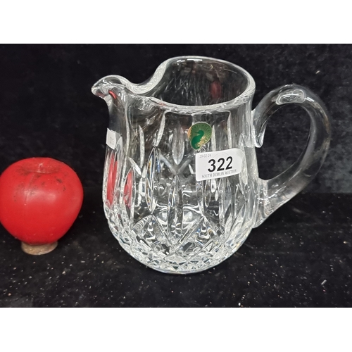 322 - A gorgeous large Waterford Crystal water pitcher jug. In excellent condition, retaining acid mark to... 