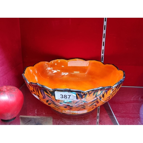 387 - A stunning large Crown Ducal ware bowl in an orange high lustre glaze with black Brazilian red peppe... 