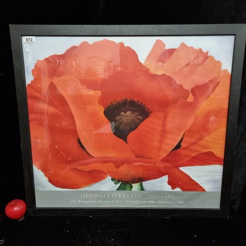 A large high quality gallery poster advertising an exhibition of Georgia O'Keeffe's work at the Metropolitan Museum of Art which ran November to February 1988/89. Features her work titled "Red Poppy" dating to 1927. Housed in a smart black wooden frame.