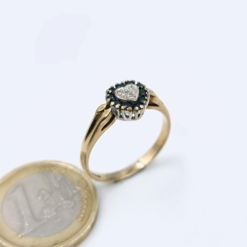 506 - Star Lot : A very pretty antique nine carat gold heart shaped ring set with sapphire and diamond clu... 