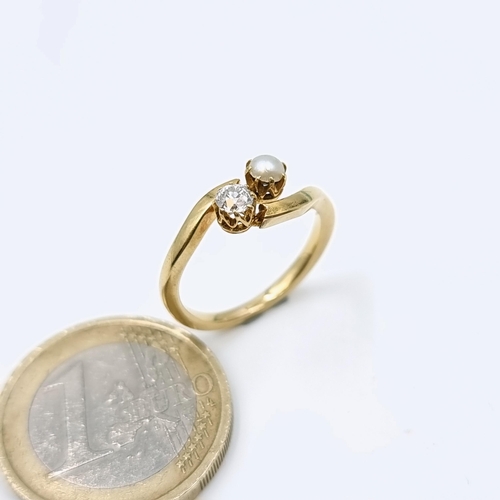 511 - An unmarked 9 carat gold diamond and pearl ring set on twist mount. Size - J 1/2. Weight - 2.86 gram... 