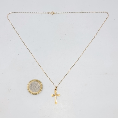 531 - A nine carat gold pendant cross & chain. Length - 46 cms. Weight - 1.26 grams.