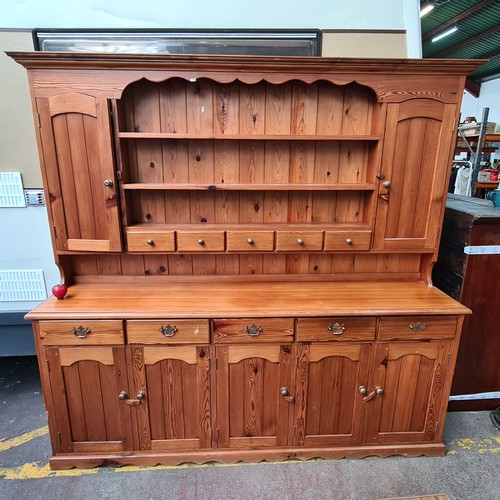 422 - Star Lot : A super large antique pine dresser featuring lots of storage space and attractive brass p... 