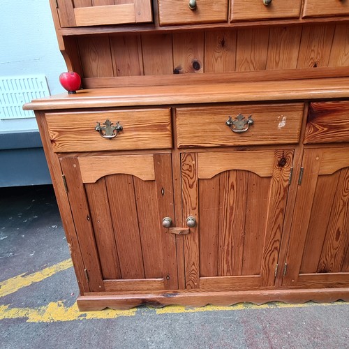 422 - Star Lot : A super large antique pine dresser featuring lots of storage space and attractive brass p... 