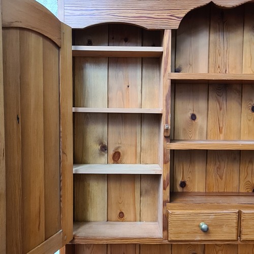 422 - Star Lot : A super large antique pine dresser featuring lots of storage space and attractive brass p... 