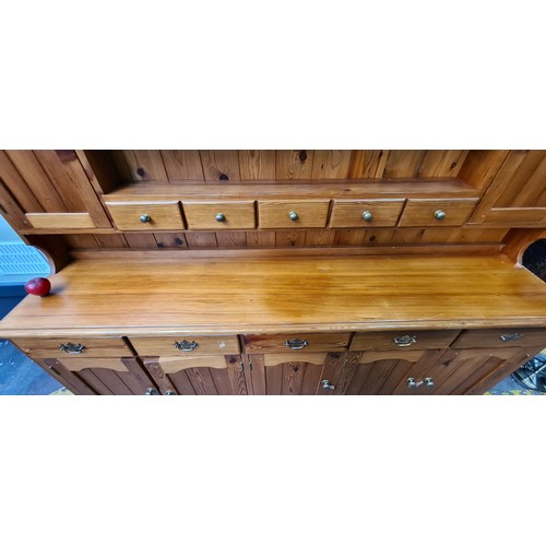 422 - Star Lot : A super large antique pine dresser featuring lots of storage space and attractive brass p... 