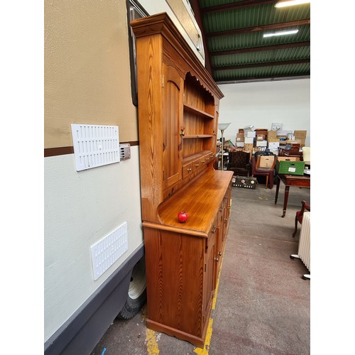 422 - Star Lot : A super large antique pine dresser featuring lots of storage space and attractive brass p... 