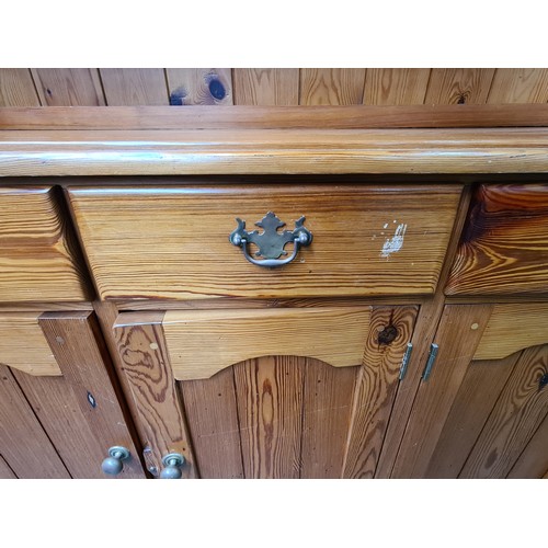 422 - Star Lot : A super large antique pine dresser featuring lots of storage space and attractive brass p... 