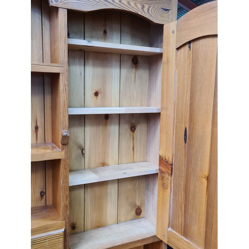 422 - Star Lot : A super large antique pine dresser featuring lots of storage space and attractive brass p... 